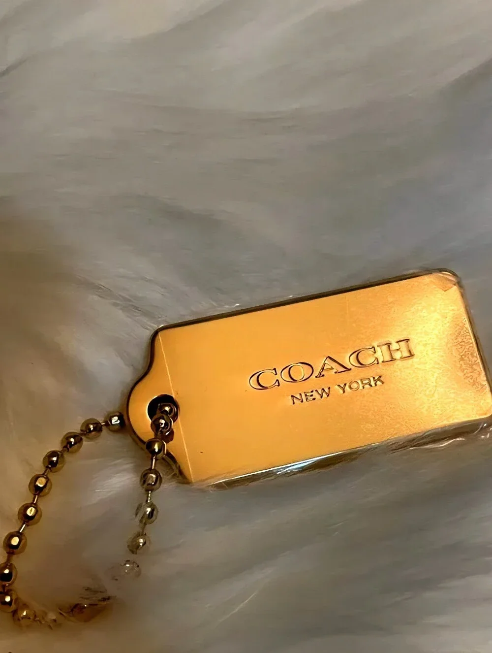 COACH CHARM NEW YORK. GOLD BRASS, THICK METAL FOB BAG KEYCHAIN HANG TAG.